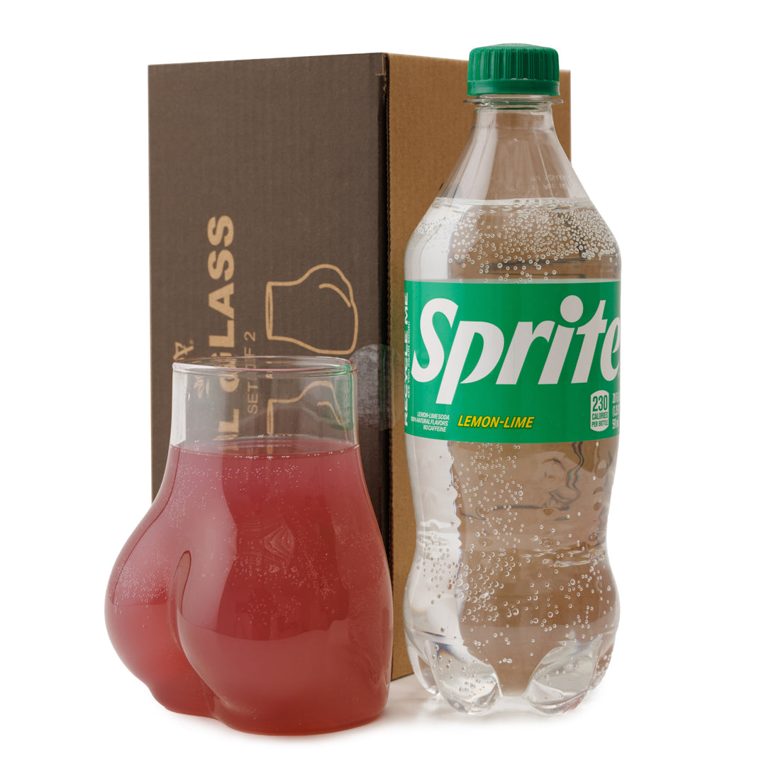 Sprite bottle with a BBL glass of red liquid on a white background