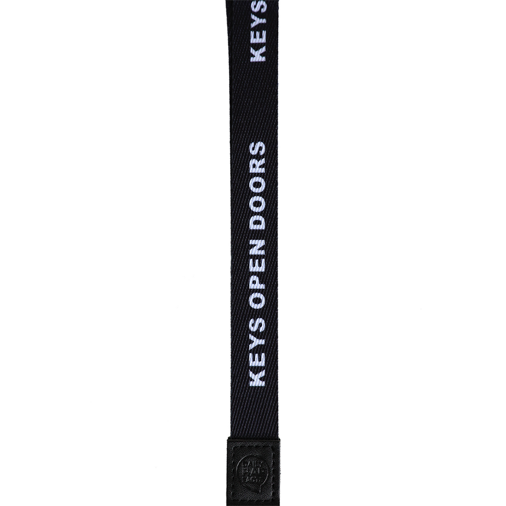 Black strap with 'Keys Open Doors' text on a white background