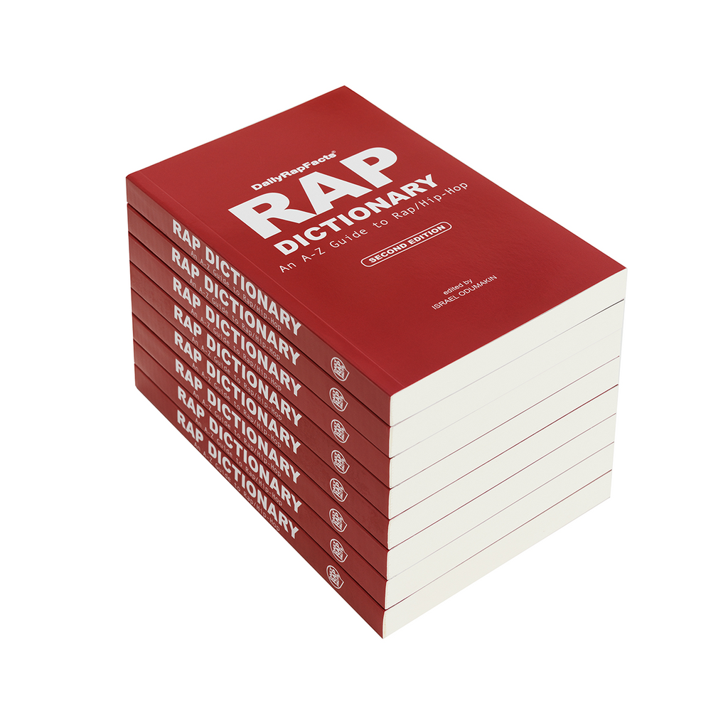 Stack of red books titled 'Rap Dictionary' on a white background