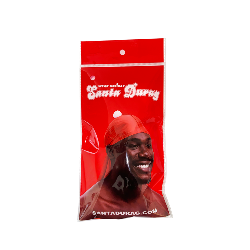 Red Santa Durag packaging with a person wearing a red durag on a white background